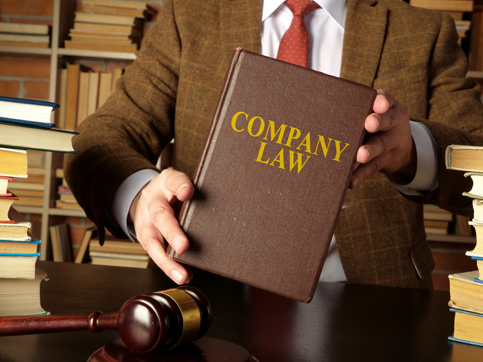 Business law book and gavel on table