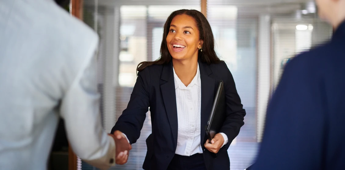 Businesswoman shaking hands during a meeting